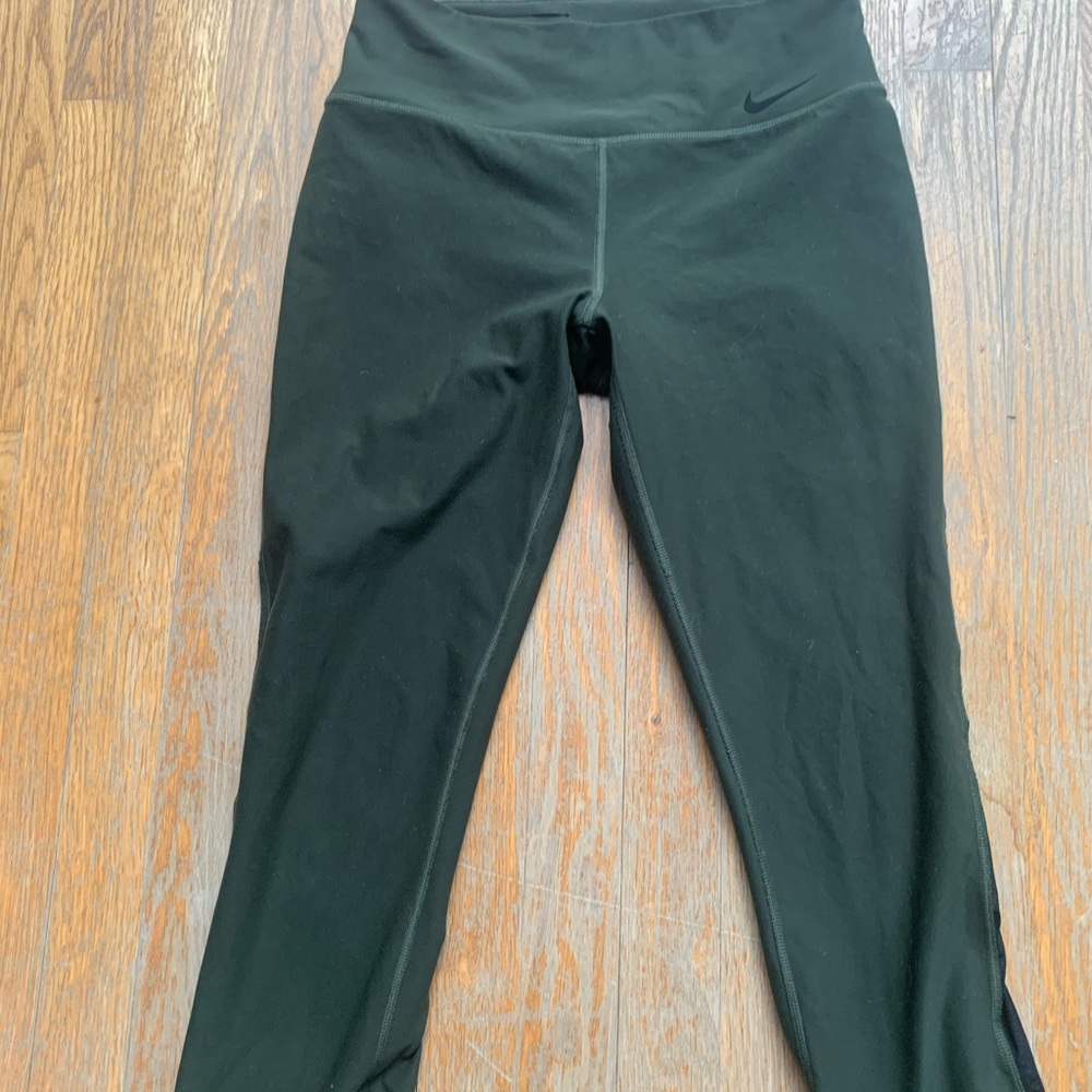 High waisted green Nike leggings with mesh